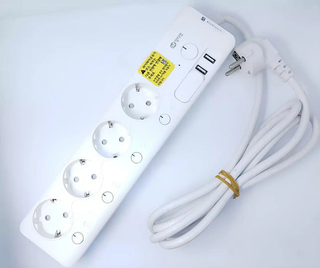 White power strip with multiple outlets and USB ports on a light gray background