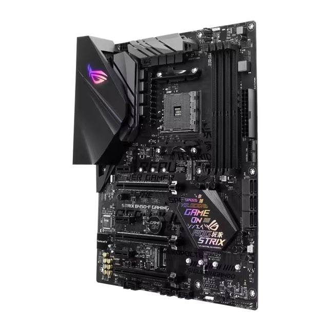 ASUS ROG Strix B450-F Gaming Motherboard in black with RGB lighting accents and gold-plated gold-plated pins, shown at an angle on a white background.