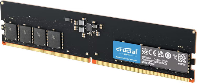 Crucial DDR5 RAM module with a black PCB, gold-plated RAM pins, four black memory chips, and a blue Crucial logo label on a white background.