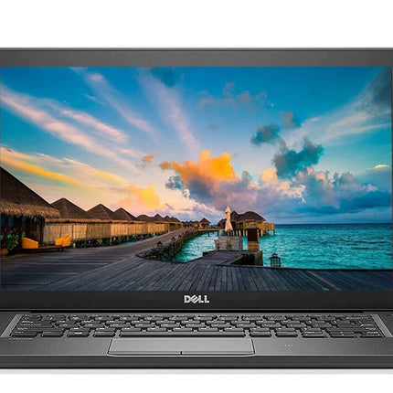Laptop displaying a scenic wallpaper on a white background