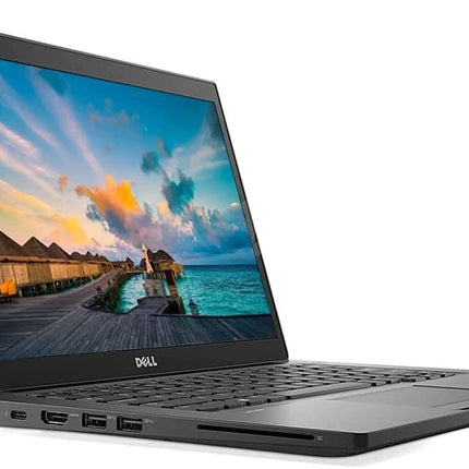 Laptop displaying a scenic wallpaper on a white background