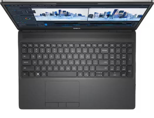 A Dell laptop shown from a top-down angle with the screen open, displaying a software interface with a cityscape preview. The laptop is dark gray/black with a full-sized keyboard and a touchpad on a solid white background.