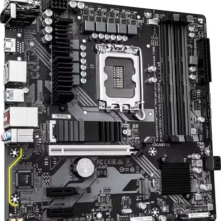 A Gigabyte LGA1200 desktop motherboard with a black PCB, silver CPU socket, and multiple black and silver components, photographed from a top-down angle on a white background.