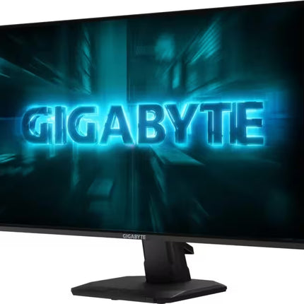Three-quarter front view of a Gigabyte gaming monitor displaying a neon blue GIGABYTE logo on screen.