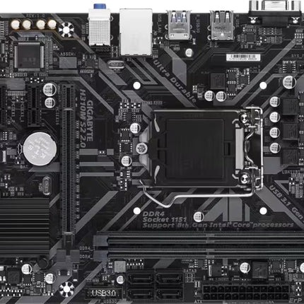 A top-down view of a black Gigabyte H310M S2 2.0 micro-ATX motherboard. The board features an Intel LGA 1151 CPU socket near the center, two DDR4 RAM slots below it, and a PCIe x16 expansion slot to the left. Various electronic components like capacitors, connectors, and a small heatsink are visible across the circuit board, with input/output ports lining the top edge.