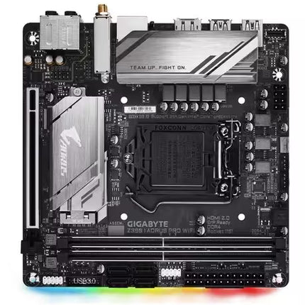 Front view of the Gigabyte Z390 AORUS PRO WiFi Mini-ITX motherboard, featuring an Intel LGA 1151 socket, two DDR4 memory slots, PCIe x16 slot, dual M.2 heatsinks, integrated Wi-Fi, RGB lighting, and a compact black PCB with silver AORUS heatsinks.
