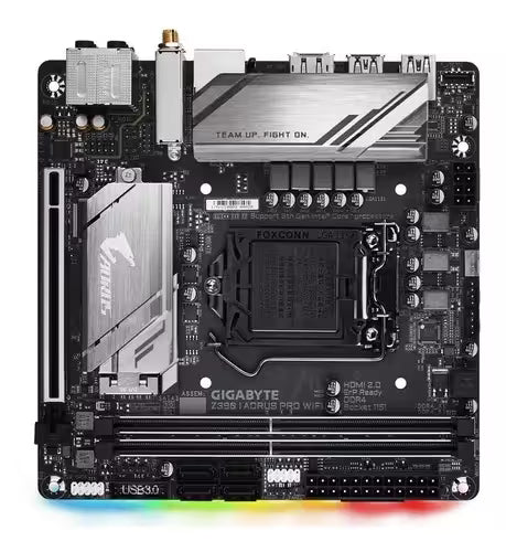 Front view of the Gigabyte Z390 AORUS PRO WiFi Mini-ITX motherboard, featuring an Intel LGA 1151 socket, two DDR4 memory slots, PCIe x16 slot, dual M.2 heatsinks, integrated Wi-Fi, RGB lighting, and a compact black PCB with silver AORUS heatsinks.