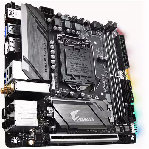 Angled perspective of the Gigabyte Z390 AORUS PRO WiFi Mini-ITX motherboard, showcasing the Intel LGA 1151 socket, dual DDR4 DIMM slots, PCIe x16 slot, silver AORUS heatsinks, integrated Wi-Fi module, SATA ports, and RGB lighting accents.