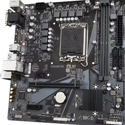 Perspective view looking from the upper-left corner of a Gigabyte H610M S2 DDR4 motherboard against a white background. The image details the arrangement of the 6+1+1 phase VRM power delivery capacitors surrounding the processor socket, the expansion slots, and the SATA ports on the right edge.