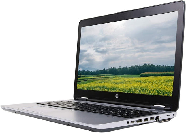 Laptop displaying a scenic view of a field on its screen