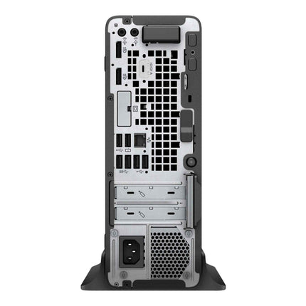 Back view of a computer tower with various ports and components on a white background
