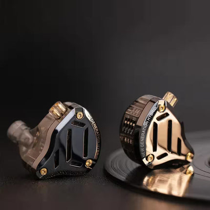 KZ ZS10 Pro 2 in-ear wired earphones with black and gold metal housings, hybrid driver design, and translucent ear tips, displayed on a dark reflective surface.