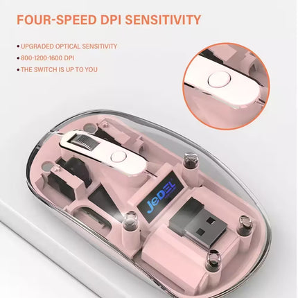 Close-up of a pink computer mouse with visible branding and technical specifications.