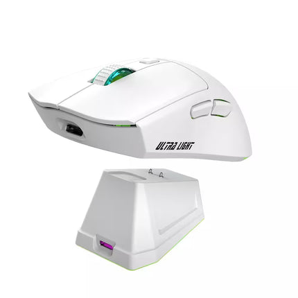 White gaming mouse with charging base on a white background