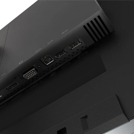 Close-up of a black electronic device with ports on a dark surface