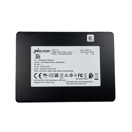 A black rectangular Micron SSD battery with a white product specification label on the front, photographed against a solid white background.