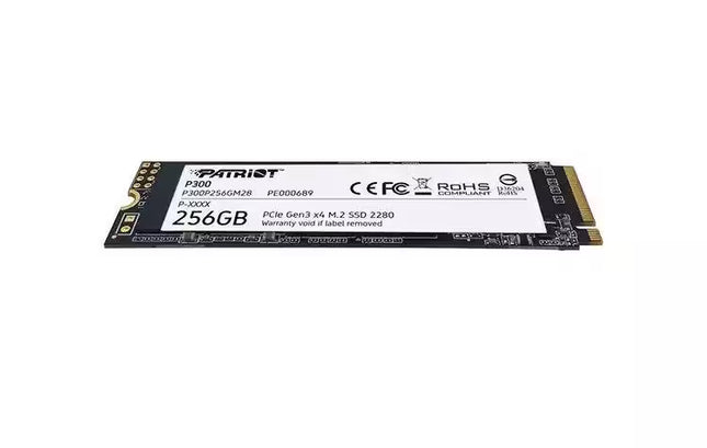 Low-angle view of the Patriot P300 256GB M.2 2280 NVMe SSD showing its slim profile, black PCB, white product label, and gold M.2 edge connector.
