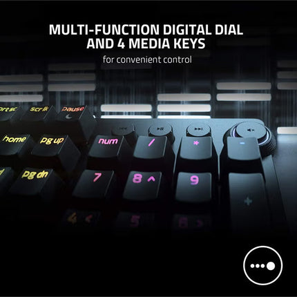 Gaming keyboard with multi-function digital dial and media keys on a dark background