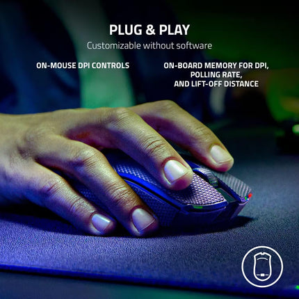 Hand using a gaming mouse with text highlighting features on a dark background