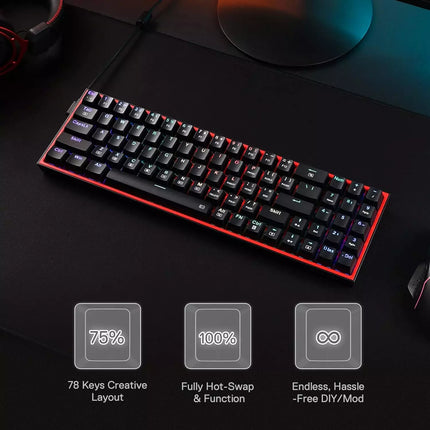 Mechanical keyboard with red accents on a dark surface.