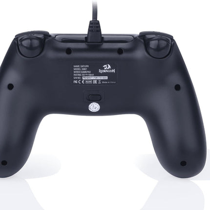 Black gaming controller with a visible brand logo on a white background