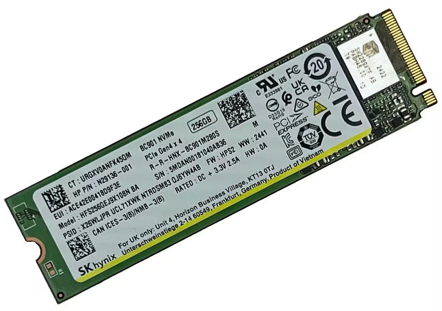 An SKHynix M.2 NVMe solid state drive with a green PCB and a large white label containing specifications, barcodes, and regulatory marks, with a gold-plated connector on the right.