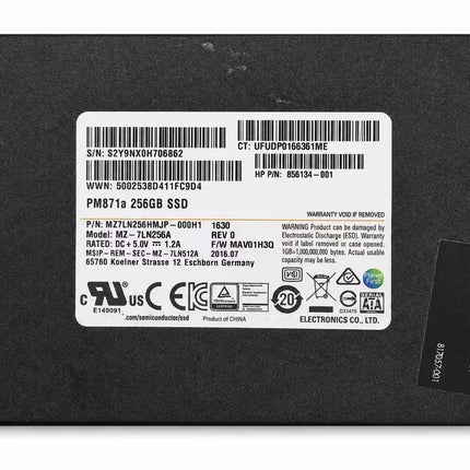 A 256GB SSD drive with a black metal casing and a white product information label on the front, photographed on a white background.
