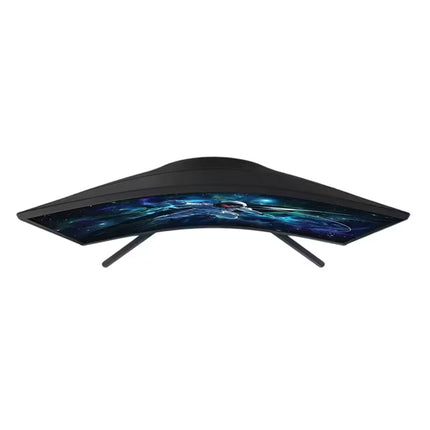 A curved gaming monitor with a black frame and stand, displaying a blue and black galaxy wallpaper, isolated on a white background.