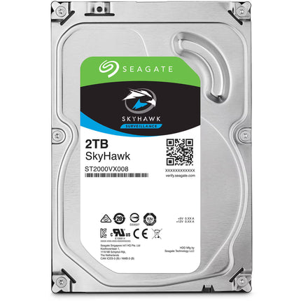 A Seagate Skyhawk 2TB enterprise hard drive with a silver metal casing and a white, green, and black product label.