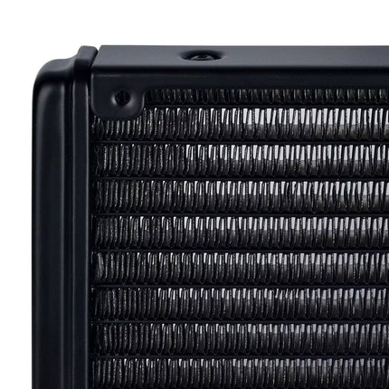 Close-up of a black radiator with ribbed metal fins on a white background