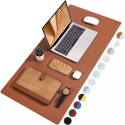 A large rectangular desk mat in a warm tan-brown color is shown from above with a laptop, mouse, notebook, phone, plant, and watch arranged on it. A vertical row of circular color swatches appears along the right edge.