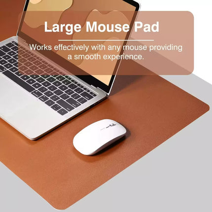 A large brown mouse pad on a light gray desk surface, shown with a white computer mouse and part of a silver laptop. Text on the image reads 'Large Mouse Pad' and 'Works effectively with any mouse providing a smooth experience.