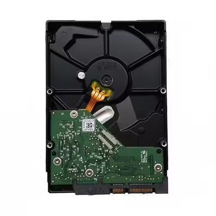 Back view of a Western Digital Black 1TB 3.5-inch internal HDD with the green printed circuit board (PCB), spindle motor hub, and SATA interface visible.