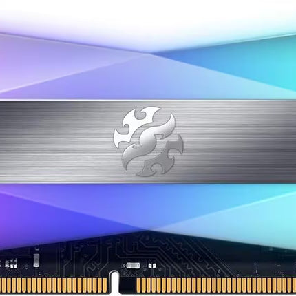 A high-performance DDR4 RAM module featuring a large, multi-colored geometric heat spreader with purple, blue, and green gradients, a brushed silver center stripe with a stylized dragon logo, and gold-plated contacts on the bottom.