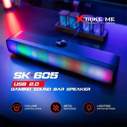 Gaming sound bar speaker with colorful LED lights on a dark surface, featuring the brand 'XTRIKE ME'.