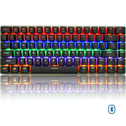 A compact black mechanical keyboard with vibrant RGB backlighting showing a rainbow spectrum of colors, displayed on a reflective white surface with a Bluetooth symbol in the bottom right corner.