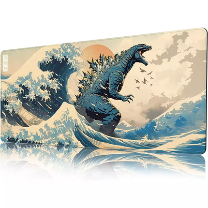 A rectangular gaming mouse pad with rounded corners, featuring a stylized Japanese wave artwork with Godzilla rising from the water. The design has a cream background with blue-gray waves and a small orange sun, with a reflection visible below on a white surface.