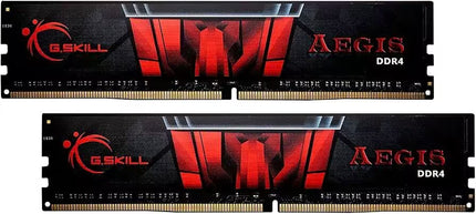 Two G.Skill Aegis DDR4 RAM modules shown side-by-side, featuring a black PCB with red and black shield-themed heat spreader stickers, red G.SKILL and AEGIS logos, and gold contact pins along the bottom edge.