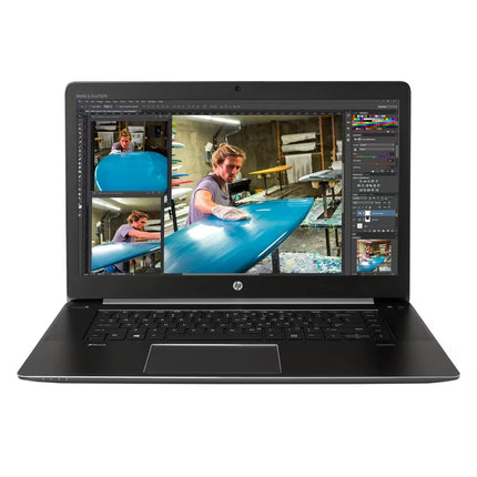 Front-facing view of an open HP ZBook workstation laptop displaying a photo editing software interface on the screen, a dark keyboard deck with ZBook branding, a large touchpad, Bang & Olufsen audio branding above the display, and an HP logo on the bottom bezel.