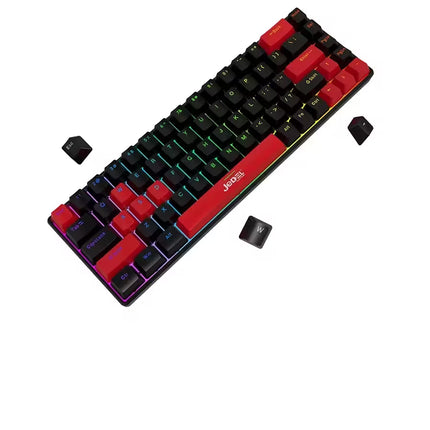 A compact mechanical keyboard with black and red keycaps, RGB backlighting, and three loose black keycaps placed around it on a plain white background.
