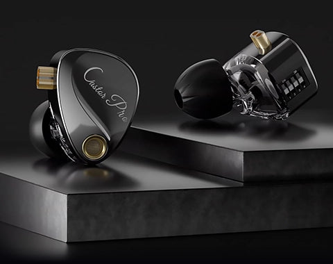 High-end earbud headphones on a black platform with a dark background