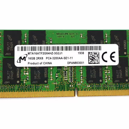A green SODIMM RAM memory module with gold-plated contacts and a white barcode label in the center, photographed on a plain white background.