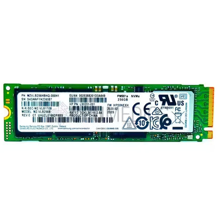 Samsung 256GB M.2 NVMe PCIe SSD (model PM981a) featuring a green printed circuit board, labeled product specifications and barcodes, and standard M.2 gold contact pins.   