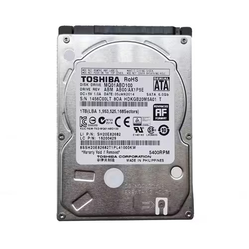 Front view of a Toshiba 1TB 2.5-inch internal hard disk drive (HDD) with a silver metal enclosure, SATA 6.0 Gb/s interface, 5400 RPM spindle speed, and a factory label displaying product specifications and serial information.