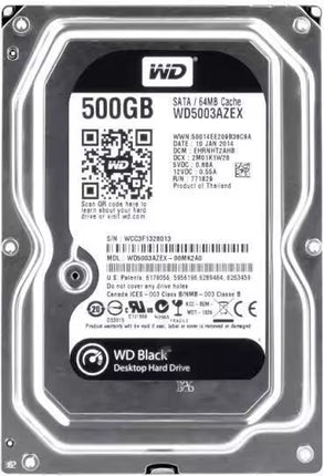 Top-down view of a Western Digital Black 500GB 3.5-inch internal hard drive featuring a metallic silver casing, a white central product label with the WD logo, model number WD5003AZEX, barcodes, regulatory certifications, and WD Black desktop hard drive branding.   